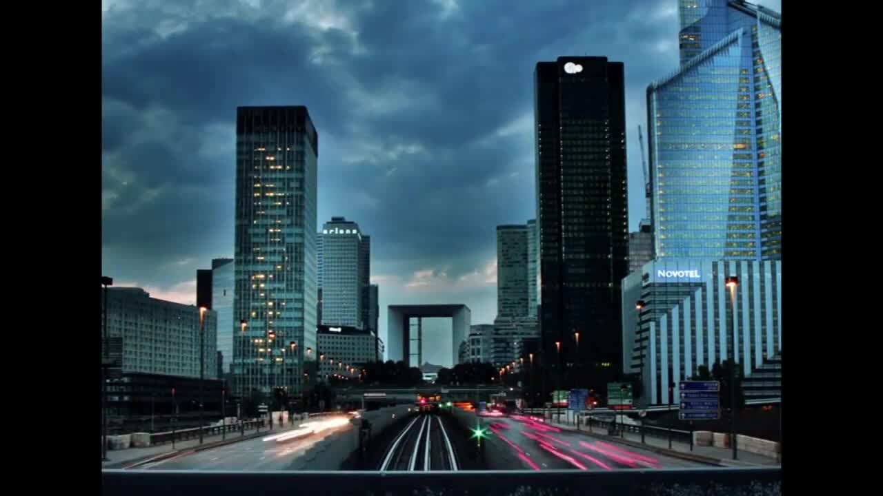 Al Maryah financial district towers illuminated at dusk